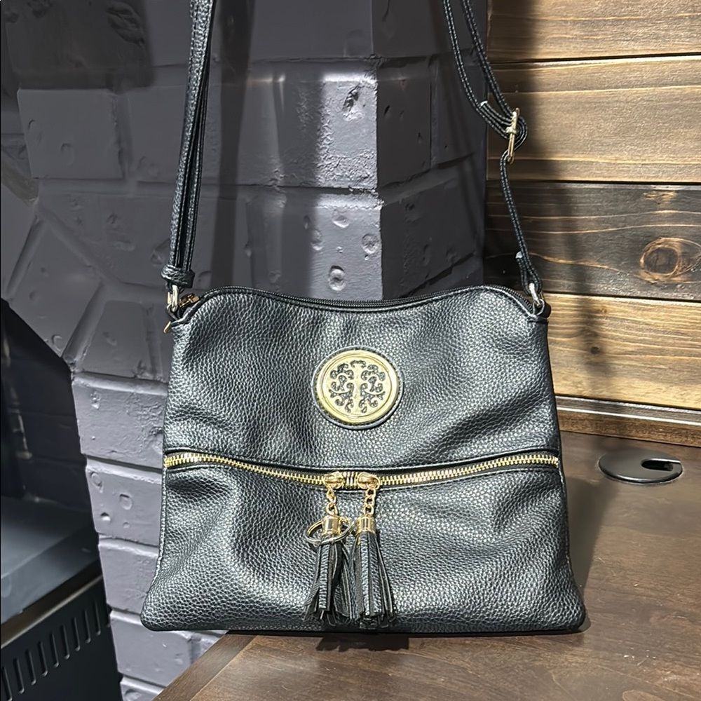 Rebecca & Rifka Black Adjustable Crossbody Bag with Tassel Zipper Detail